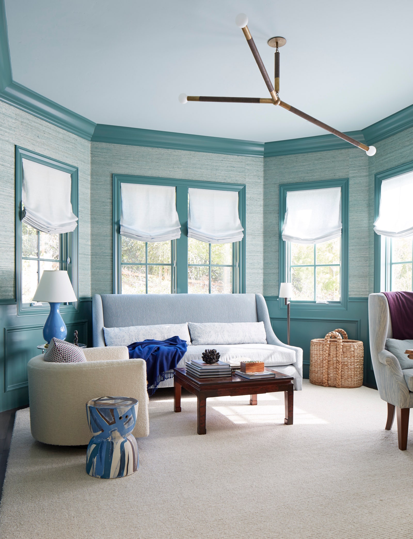 Verdigris enlivens the trim in this sunny room by Heather Hilliard Design.