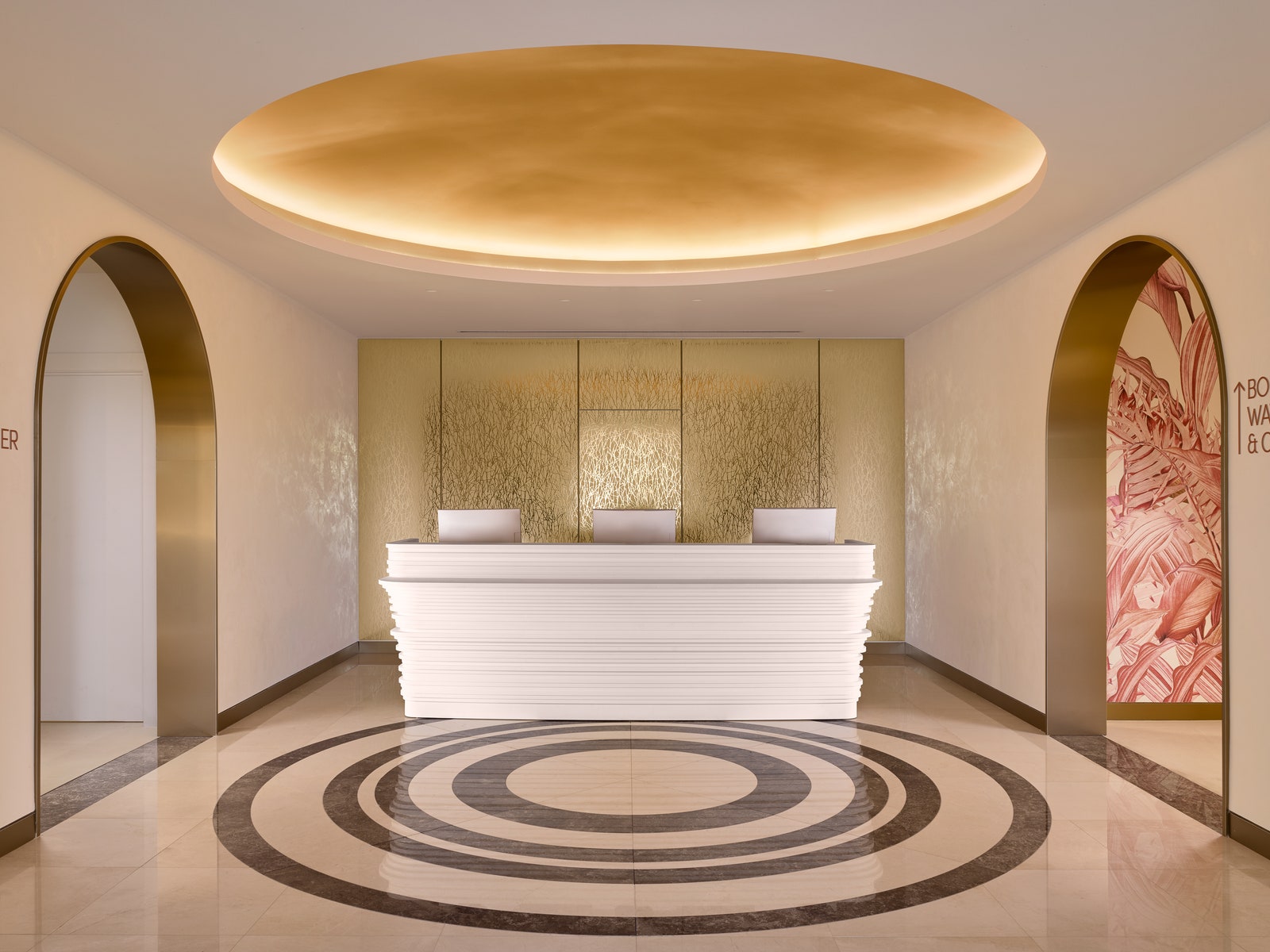 a spa lobby with a gold ceiling